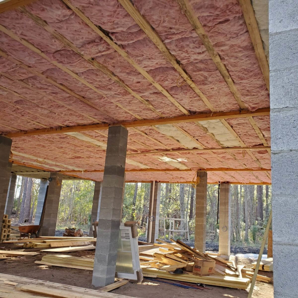 Fiberglass batt insulation installed in the ceiling of a commercial building